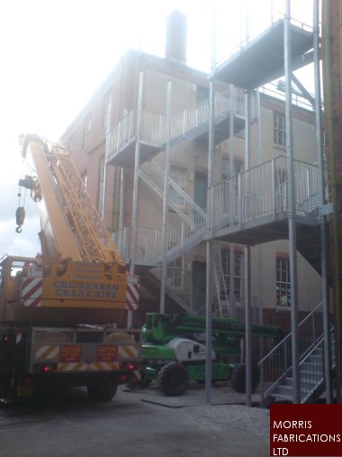 Photo of two five-flight fire escapes.