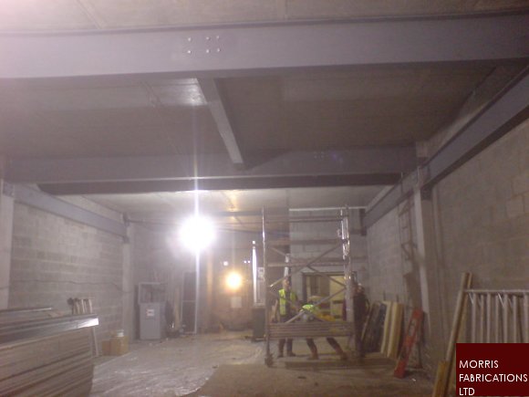 Photo of steelwork to new stairwell and lift shaft under construction.