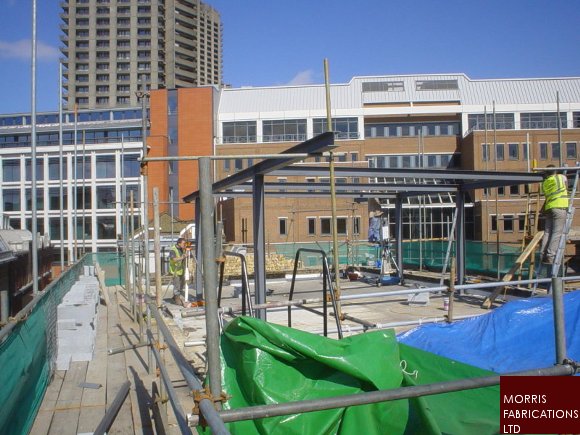 Photo of steelwork to new penthouse on existing building under construction.