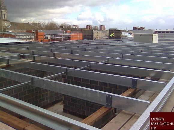 Photo of roof support steelwork under construction.