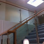 Stainless steel uprights with beech handrail and glass infill panels