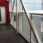 Powder coated infill balustrade with stainless steel uprights and top rail
