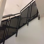 Mild steel balustrade with perforated infill panels to stairs, all powder coated finish