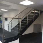 Steel staircase with stainless steel glass balustrade