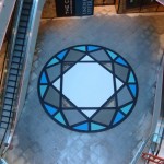 Stainless steel artwork with resin paving