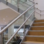 Steel staircase with stainless steel balustrade and wall rail