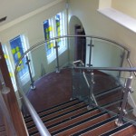 Steel staircase with stainless steel balustrade and curved landing