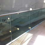 Frameless glass balustrade with stainless steel slotted tube top rail