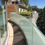Curved frameless glass balustrade with 10% etch screen print glass and curved base U-channel