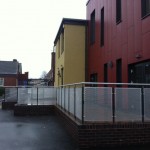 Powder coated uprights with plascoat top rail and aluminium perforated infill panels