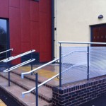 Powder coated uprights with plascoat top rail and aluminium perforated infill panels