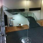 Stainless steel balustrade up stairs and across gallery