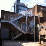 Three flight galvanised steel fire escape staircase