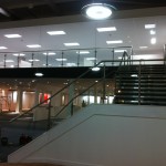 Stainless steel balustrade with glass infill panels up stairs and across gallery