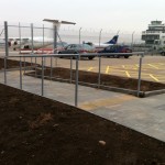Balustrade up ramp and steps outside airport hangar