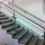 Stainless steel balustrade with glass infill panels and wall rail