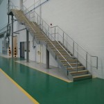 Galvanised steel staircase at airport hangar