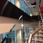 Feature staircase with frameless glass balustrade