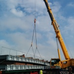 Walkway being lifted by crane