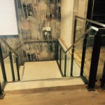 New customer staircase with RHS stringers and mild steel flat uprights, all powder coated, with stainless steel square handrail and toughened glass infill panels