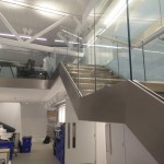 Steel staircase with frameless glass balustrade