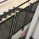 Mild steel balustrade with perforated infill panels to stairs, all powder coated finish