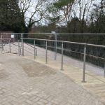 Stainless steel balustrade with curved horizontal running rails