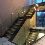 Steel staircase with frameless glass balustrade