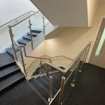 Stainless steel glass balustrade with stainless steel wall rail