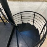 Spiral staircase with checker plate treads powder coated black