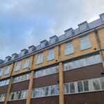Frameless glass juliette balconies to apartment block