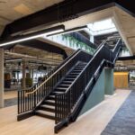 Steel staircase with balustrade to both sides